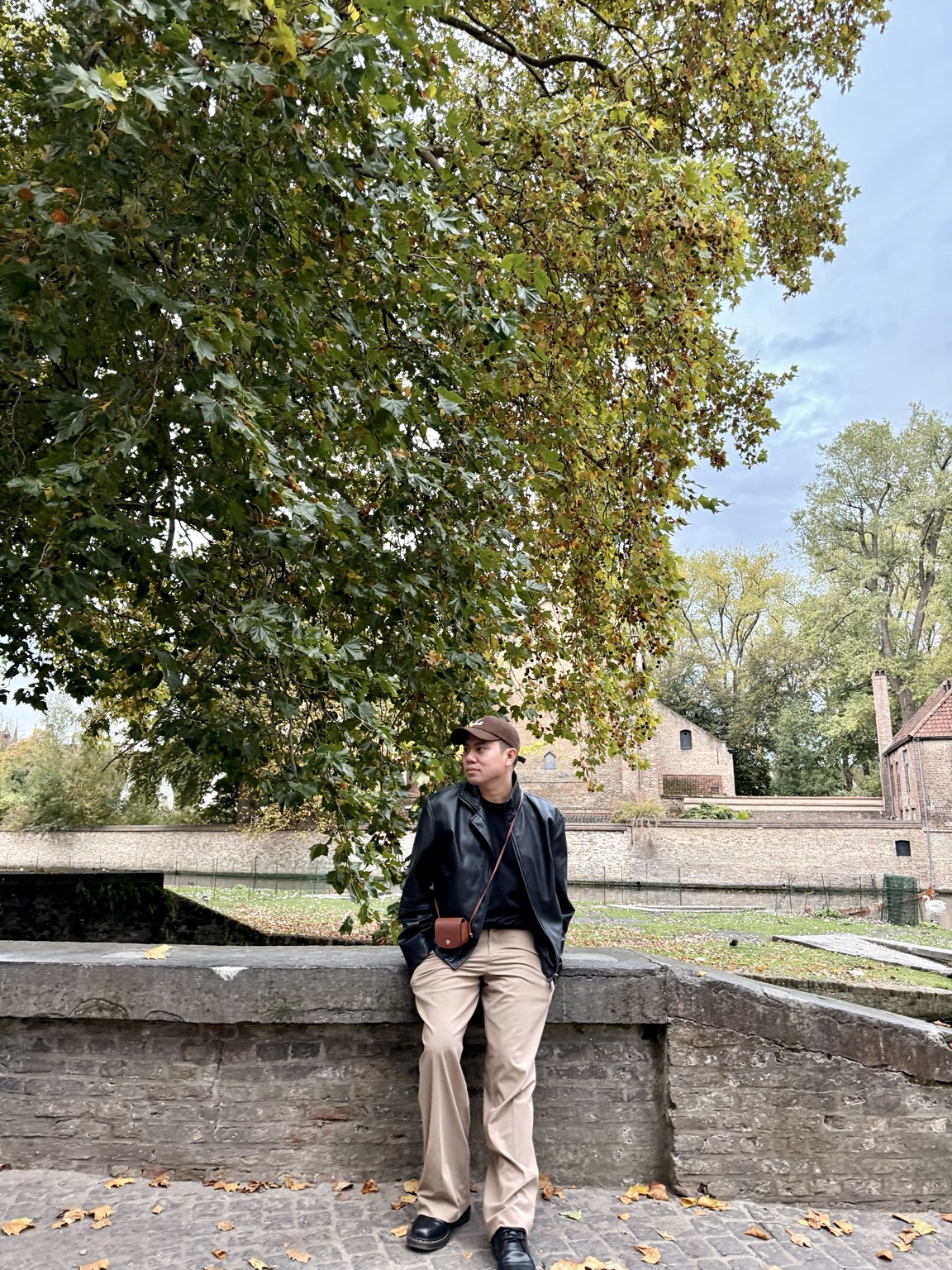An autumn pause beside a peaceful Belgian canal