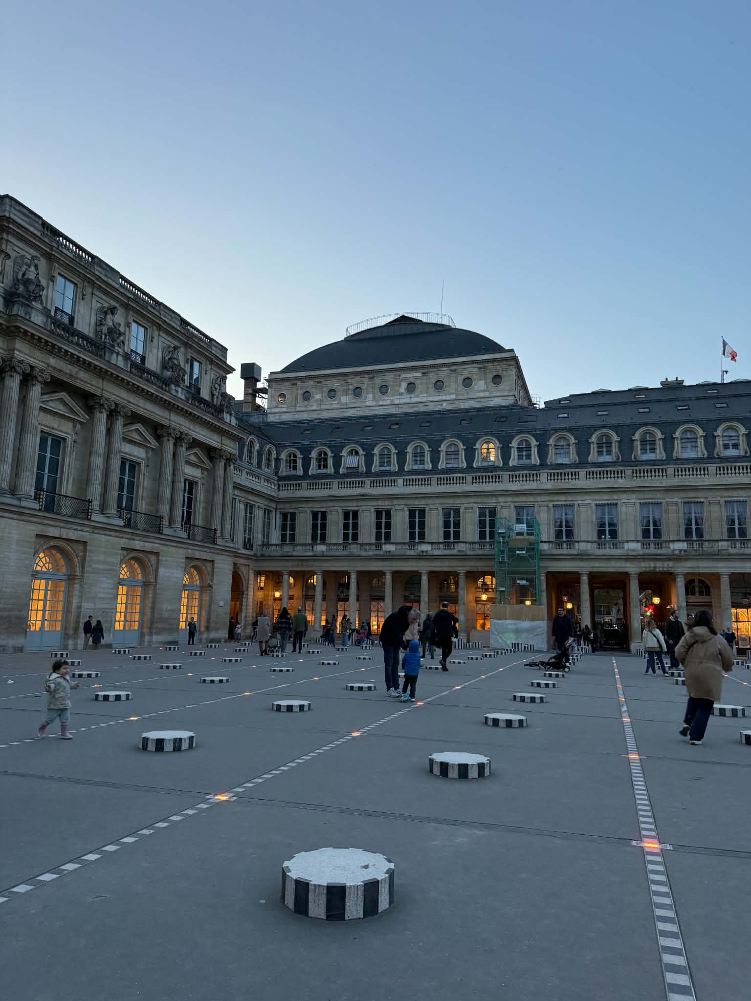 The Palais Royal courtyard at dusk